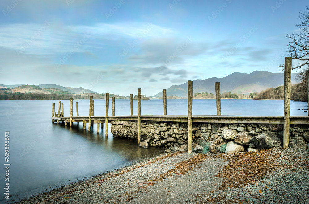 A view of Ashness jetty and landing stage on the shores of Derwentwater at Barrow Bay Keswick 