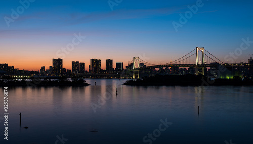 Tokyo Bay and Rainbow Bridge at Sunset © Visionsi