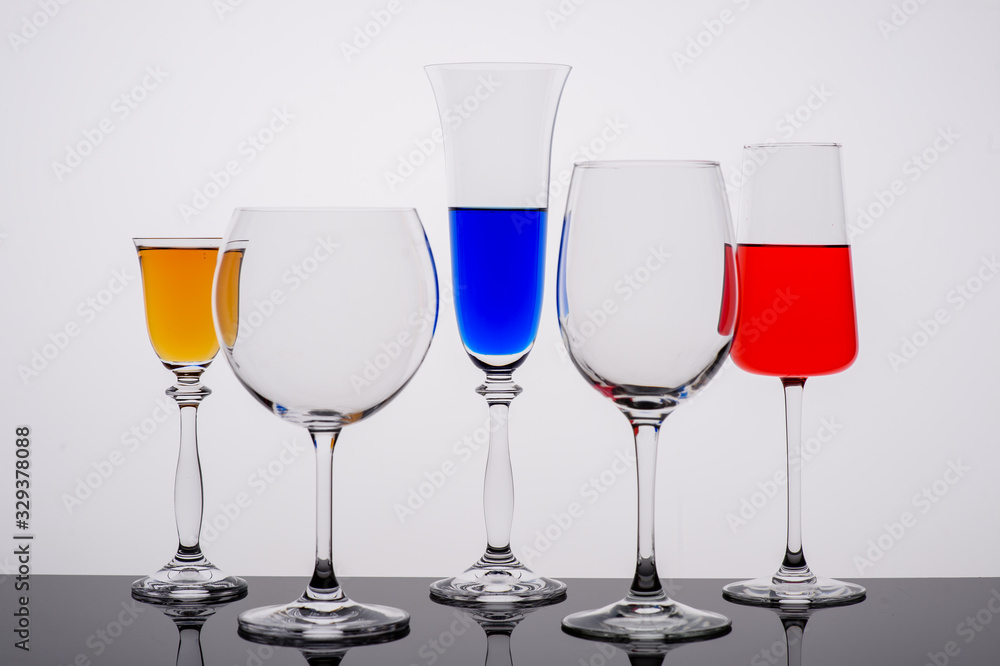 two glasses of wine on white background