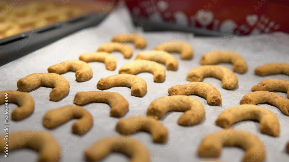 A close up detail of baked Christmas cookies on a pan. A close up detail of baked Christmas cookies on a pan.