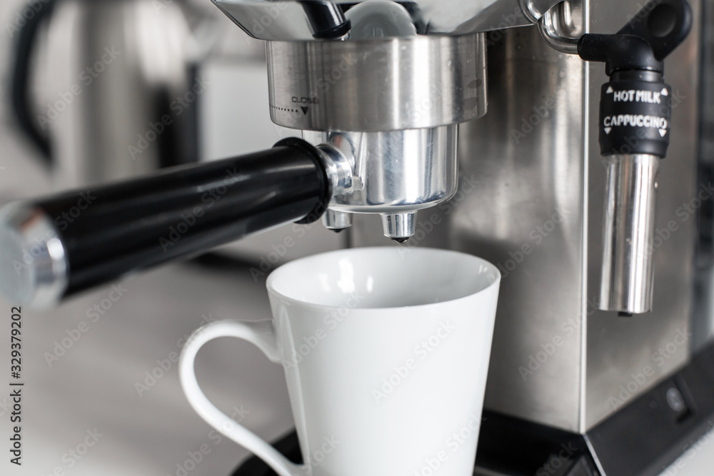 Close-up of making coffee in a coffee machine. Close-up of making coffee in a coffee machine.