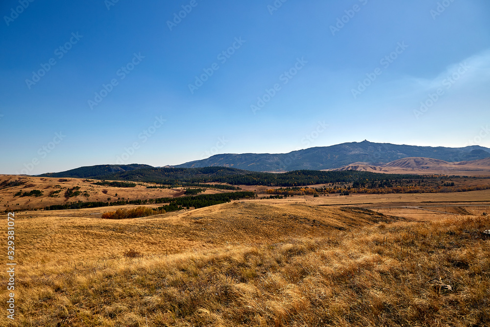 landscape steppe and wooded mountains.