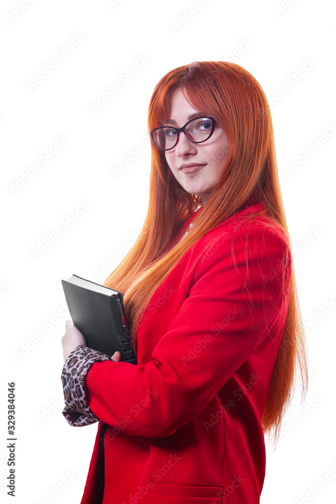 Beautiful female student in glasses in red business suit with notebook in hand Beautiful female student in glasses in red business suit with notebook in hand