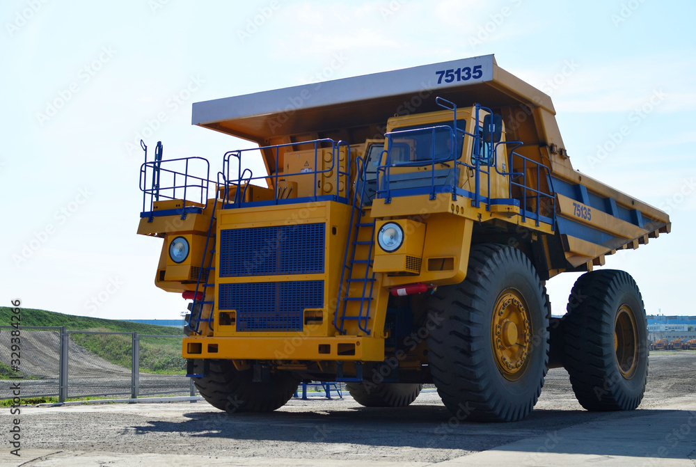 Giant mining dump truck, after being discharged from the conveyor, is tested at the factory test site. Heavy-duty truck manufacture by the heavy vehicle plant.