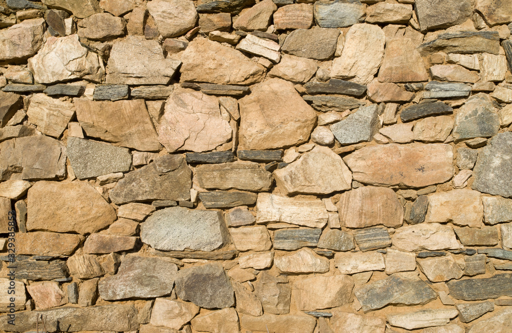 Old colorful stone wall closeup Old colorful stone wall closeup