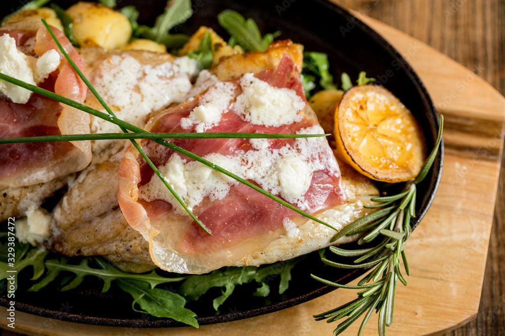Sea bream stuffed with cream cheese and smoked ham with young potatoes and leek Sea bream stuffed with cream cheese and smoked ham with young potatoes and leek