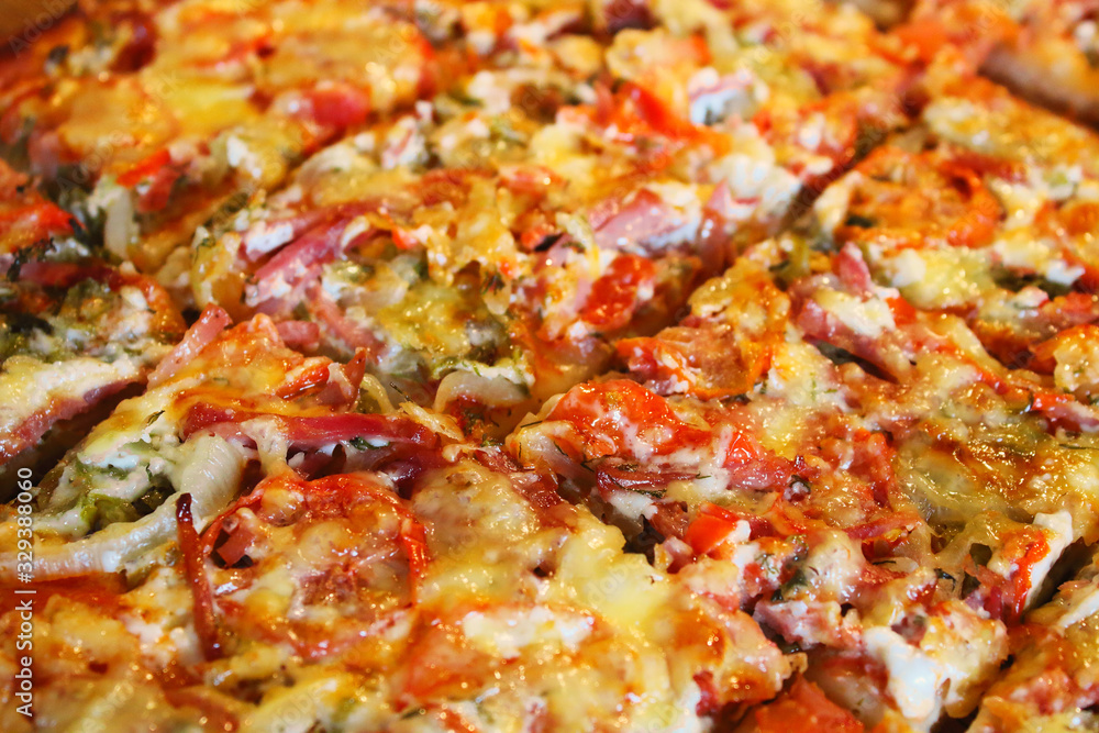 Fresh homemade sliced pizza. Close-up. Top view. Background. Texture. Fresh homemade sliced pizza. Close-up. Top view. Background. Texture.