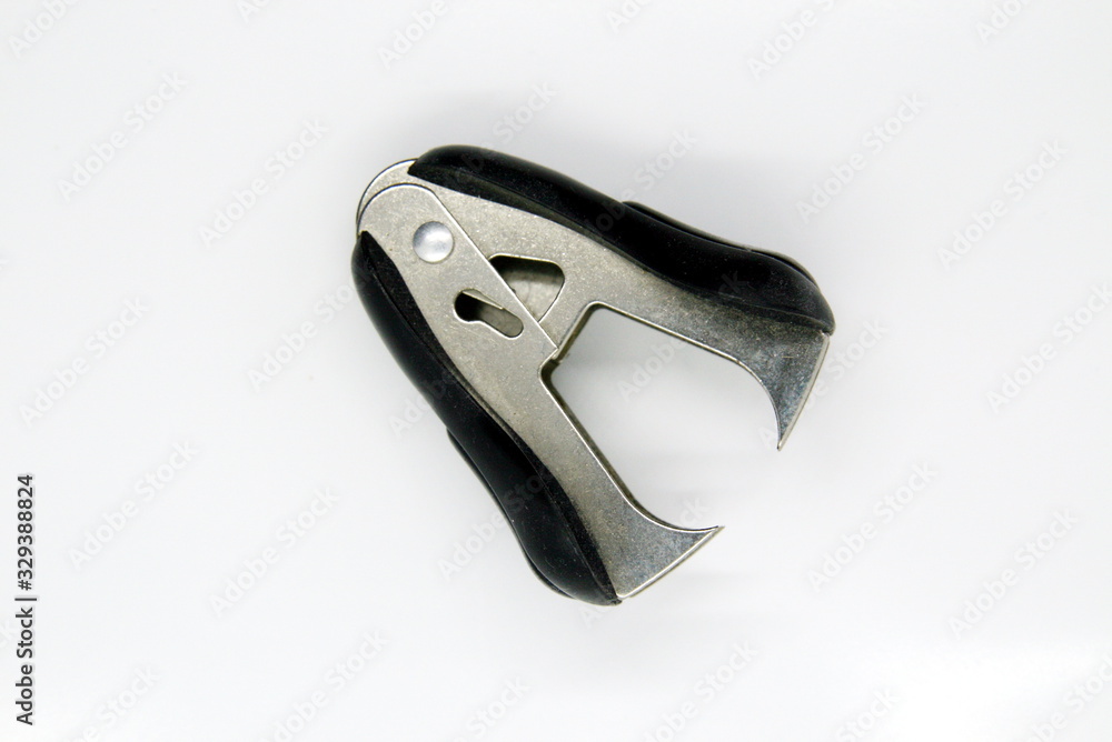 the staple remover close -up on white background the staple remover close -up on white background
