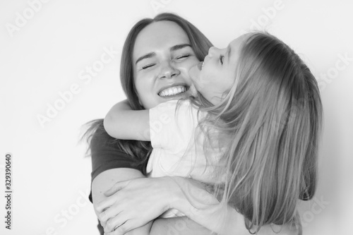 mother and daughter hug each. black-white. 