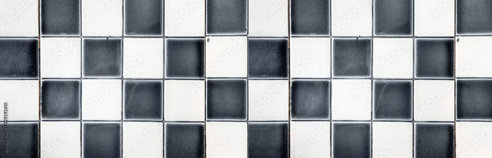 Fototapeta premium Old gray black white checkered square tiles vintage texture background 