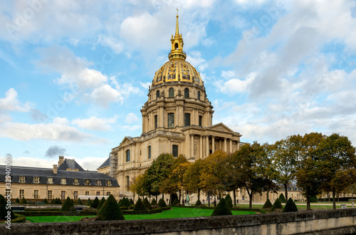 A scenic view of the Church of the Hotel des Invalides and landscaped garden from Avenue de Tourville, Paris, France © anastasstyles