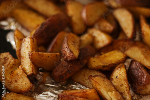 Tasty roasted potato slices , close up