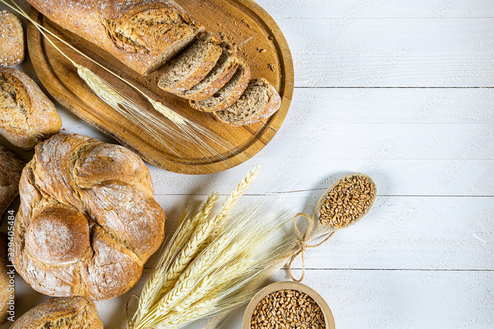 Fresh traditional bread on a brown wooden board