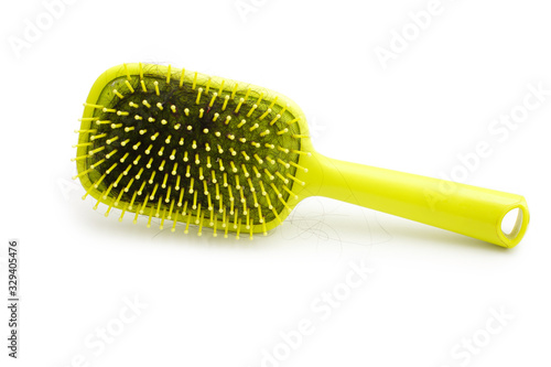 Hairs fall in comb  hair fall everyday serious problem.Hairs fall with a comb and problem hair on white background. Baldness trying hair brush. Close up . concept Hair loss  beauty  Beauty salon