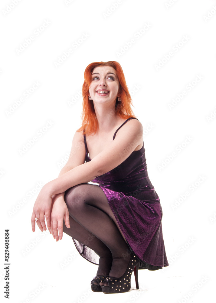 Naklejka premium young woman in tight black dress on white background