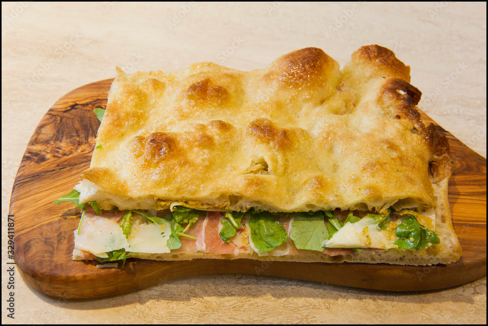 Roman stuffed focaccia sandwich with cold cuts, cheese and various vegetables