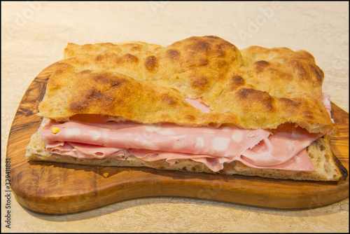 Roman stuffed focaccia sandwich with cold cuts, cheese and various vegetables