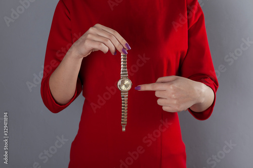 woman hand holding watch