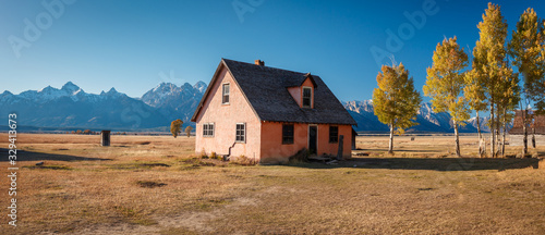 The pink house on the John Moulton ranch in Mormon Row Historic District in Grand Teton National Park, Wyoming - The most photographed barn in America photo