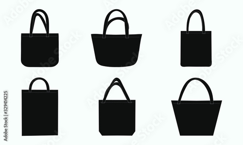 Set of black tote shopping eco fabric bags. Vector illustration of mockup blank template isolated on gray background. Canvas bags.