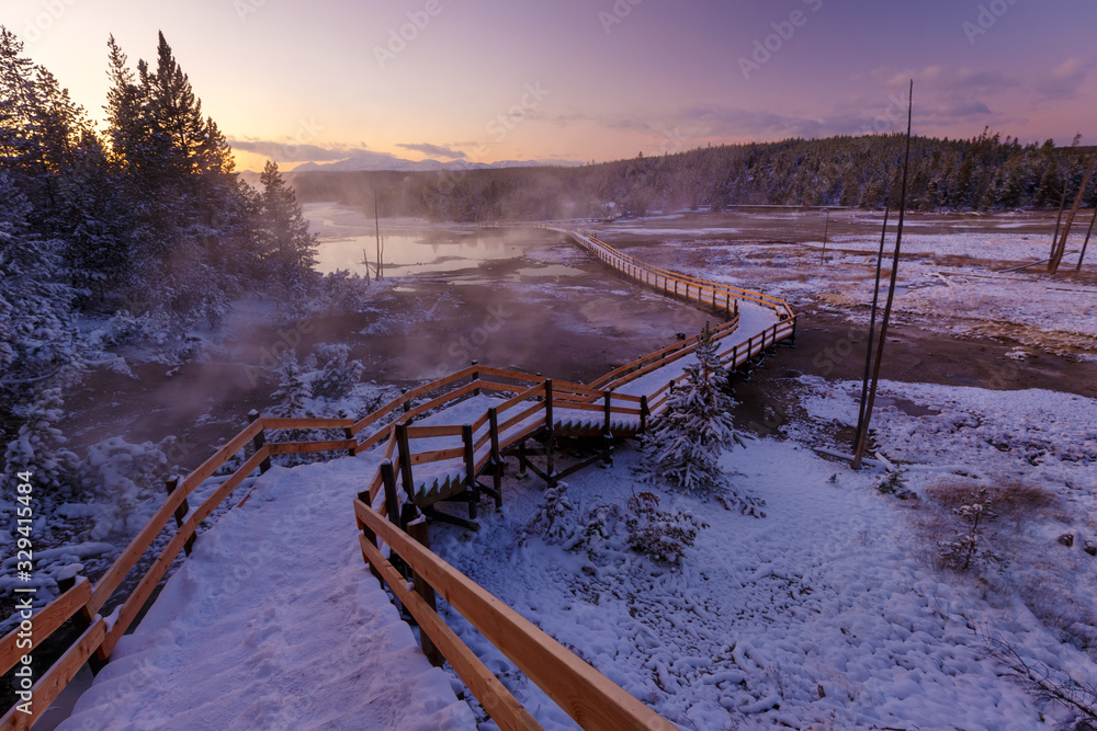 Colorful Norris Geyser Basin area trail during colorful sunset in Yellowstone National Park, Wyoming, USA