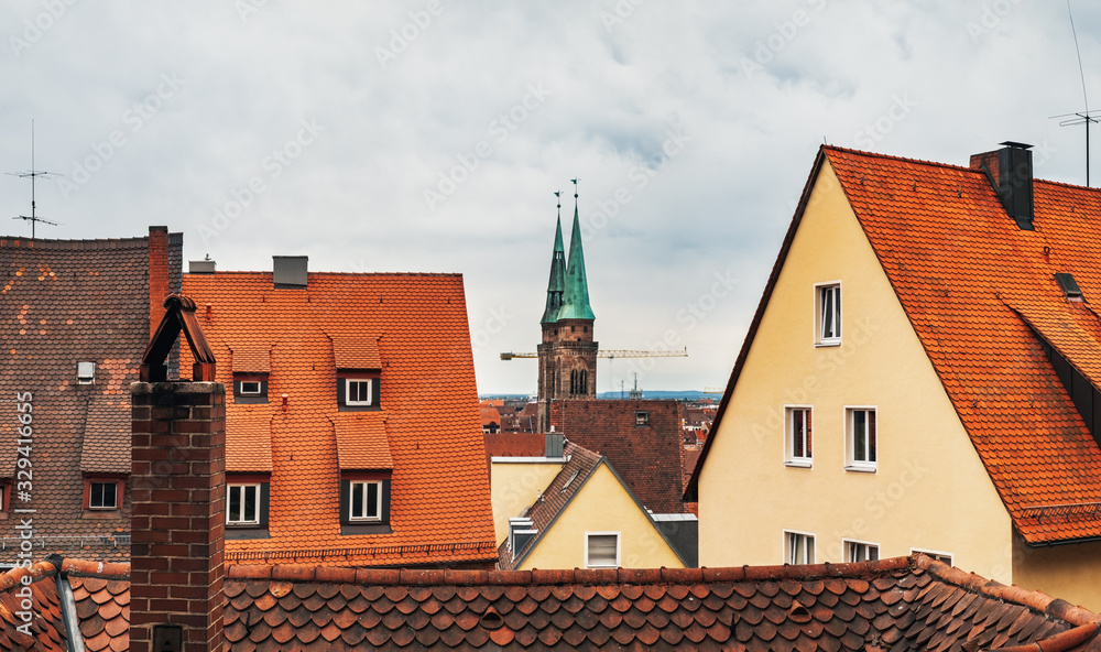 Old town architecture in German city of Nuremberg Nurnberg, Mittelfranken region, Bavaria, Germany. Terracotta and red medieval house roofs, cityscape top view from castle hill