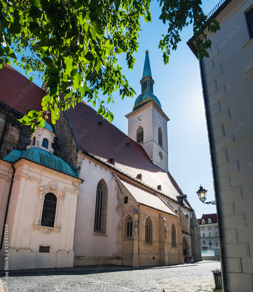 St Martin Cathedral in Old Town of Bratislava city, Slovakia, Slovak aged catholic Church under blue sky in summer St Martin Cathedral in Old Town of Bratislava city, Slovakia, Slovak aged catholic Church under blue sky in summer