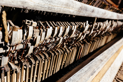 Details of strings and keys Inside of a broken wooden piano, in Arizona Desert