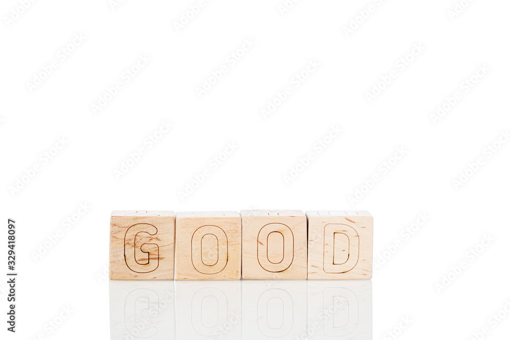 Wooden cubes with word good on a white background Wooden cubes with word good on a white background