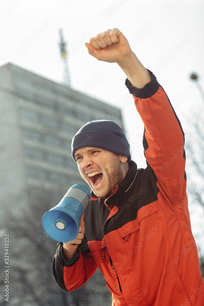 protester man screaming at megaphone protester man screaming at megaphone
