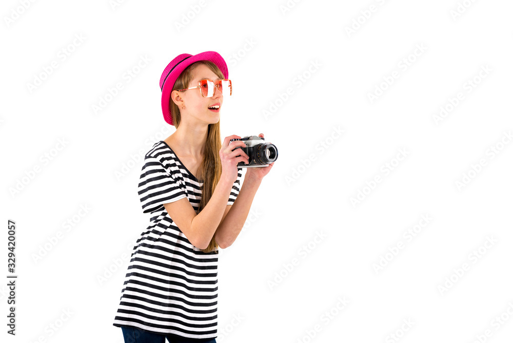 Portrait of smiling girl in striped summer casual clothes,red hat with photo camera isolated on white background. Female passenger traveling abroad to travel on weekends getaway.Journey concept. Portrait of smiling girl in striped summer casual clothes,red hat with photo camera isolated on white background. Female passenger traveling abroad to travel on weekends getaway.Journey concept.