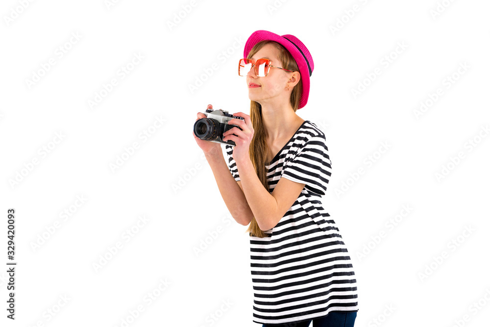 Portrait of smiling girl in striped summer casual clothes,red hat with photo camera isolated on white background. Female passenger traveling abroad to travel on weekends getaway.Journey concept. Portrait of smiling girl in striped summer casual clothes,red hat with photo camera isolated on white background. Female passenger traveling abroad to travel on weekends getaway.Journey concept.