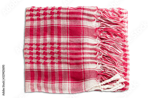 Oriental men’s national headdress Ghutrah. Traditional tissue red and white arabic man's head scarf Shemagh (Keffiyeh). Close up textile handkerchief background. photo