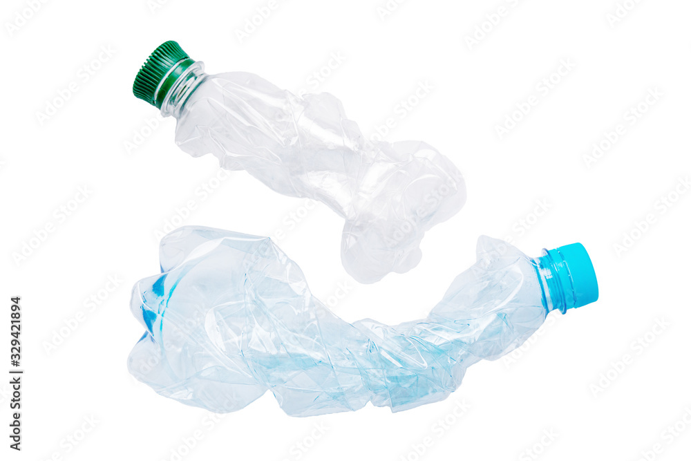 Empty used plastic PVC bottles isolated on white background. Crumpled bottle - recycle eco concept. The used plastic bottles may be recyclable. Empty used plastic PVC bottles isolated on white background. Crumpled bottle - recycle eco concept. The used plastic bottles may be recyclable.