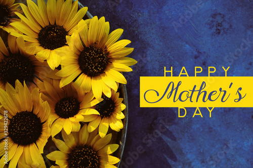 Sunflowers on blue background with Happy Mothers Day text