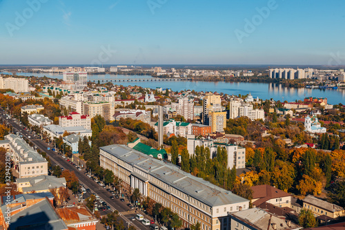 Sunny golden autumn Voronezh. Aerial view from skyscraper roof height to Revolution prospect - central street of Voronezh