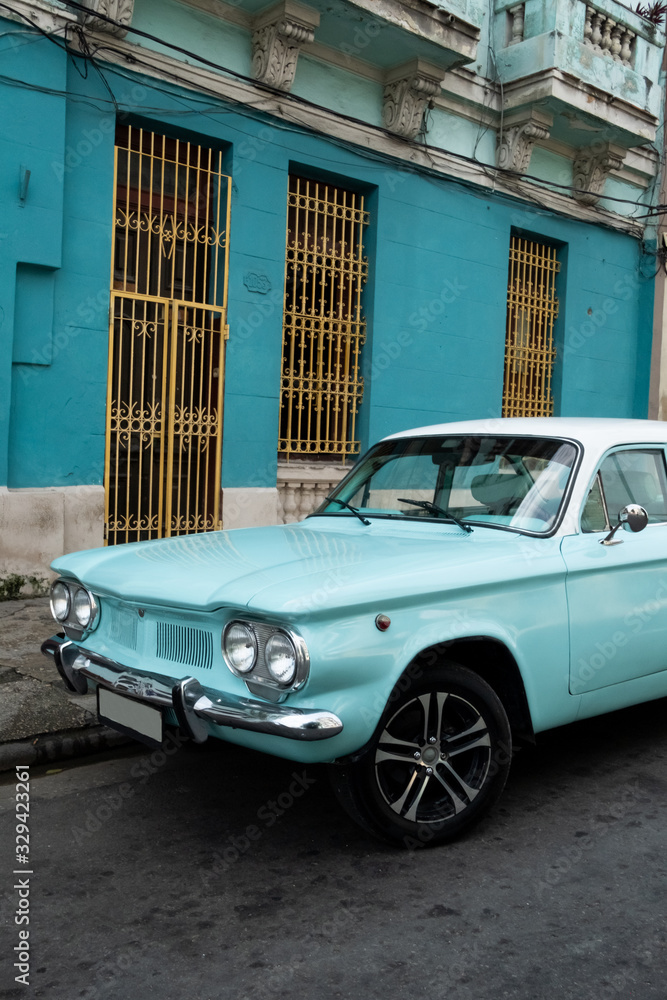 Classic blue car parked on a Havana street