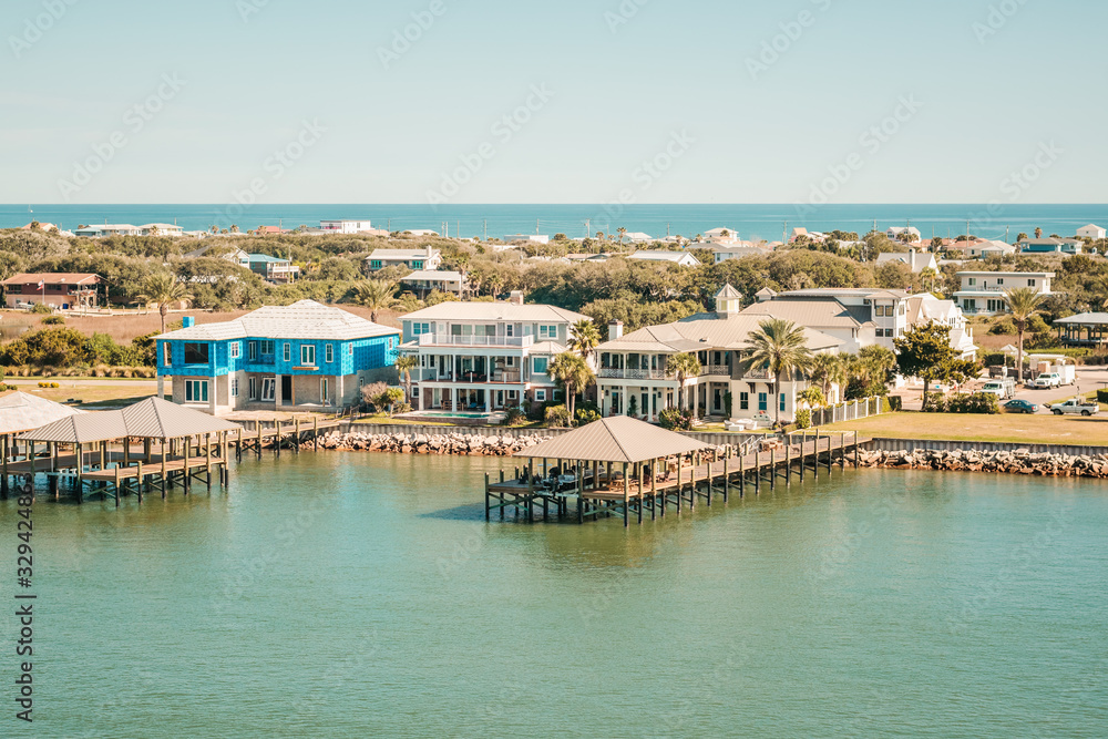 Condo Buildings and New Construction and Dock Along Coastal Inlet with Ocean in Distance