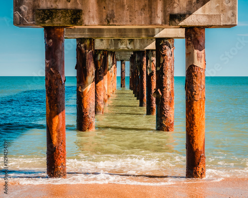 Wooden Posts of Pier Surrounded by Aqua Water