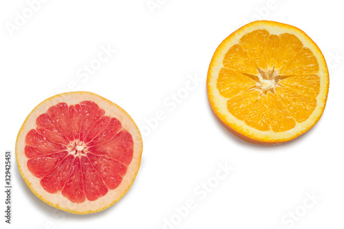 Slices of orange and red grapefruit isolated on white