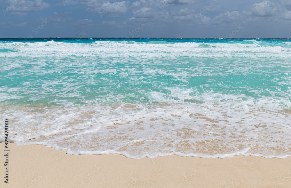 The transparent turquoise waters of Delphin beach or Playa Delfin by the Caribbean Sea in Cancun, Yucatan Peninsula, Quintana Roo state, Mexico. The transparent turquoise waters of Delphin beach or Playa Delfin by the Caribbean Sea in Cancun, Yucatan Peninsula, Quintana Roo state, Mexico.