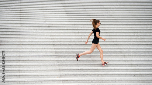 Workout outdoors. Energetic woman run stairs outdoors. Active life. Feel free. Freedom concept. Symbol of freedom. Travel and wanderlust. Freedom to explore. Fitness trainer. Exercising urban space