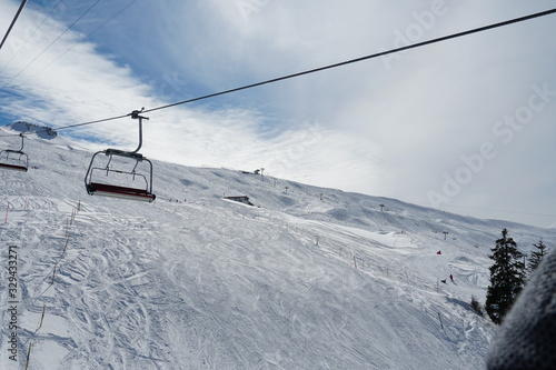 Empty chair lifts in ski resort Switzerland closing up because of corona virus and lock down.