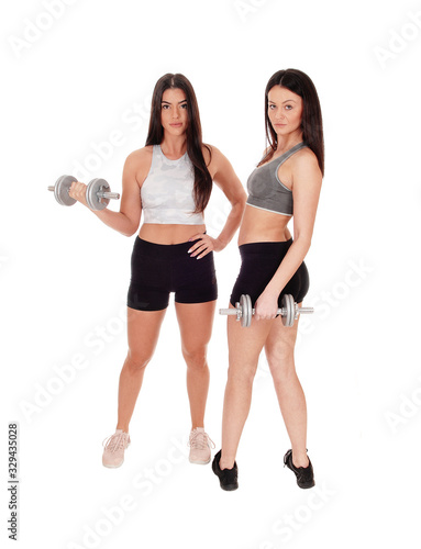 Two woman exercising with dumbbells in the studio © 80Feierabend