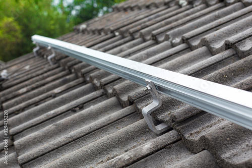 Εκτύπωση καμβά Close up of mounting rail for photovoltaic system on roof building site