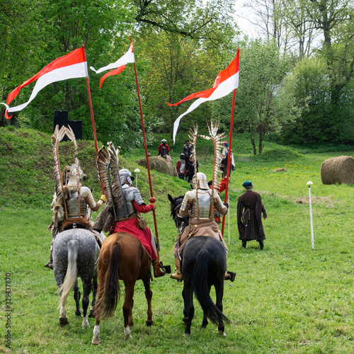 Fotografie A man in vintage poland armor with wings. Polish winged hussars.