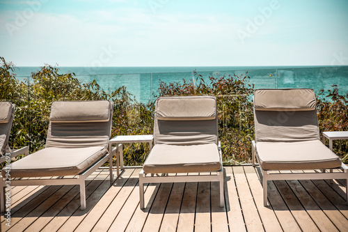 Billede på lærred summer chair on deck and free space for your decoration