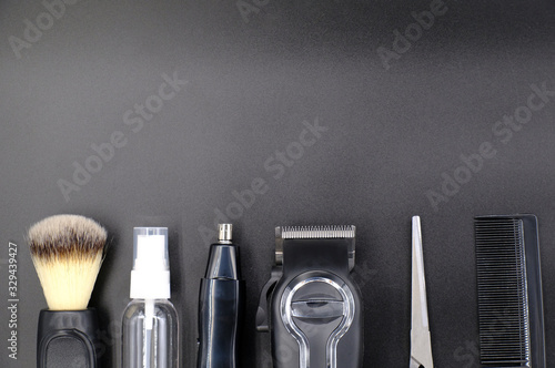 top view of professional barber tools and blank black space