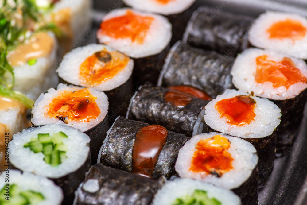 Variety of sushi food. Top view. Traditional asian food with raw fish and rice. Sushi rolls set Variety of sushi food. Top view. Traditional asian food with raw fish and rice. Sushi rolls set