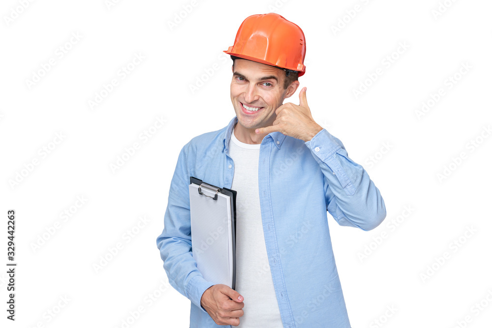 Cheerful builder in helmet shows Cheerful builder in helmet shows